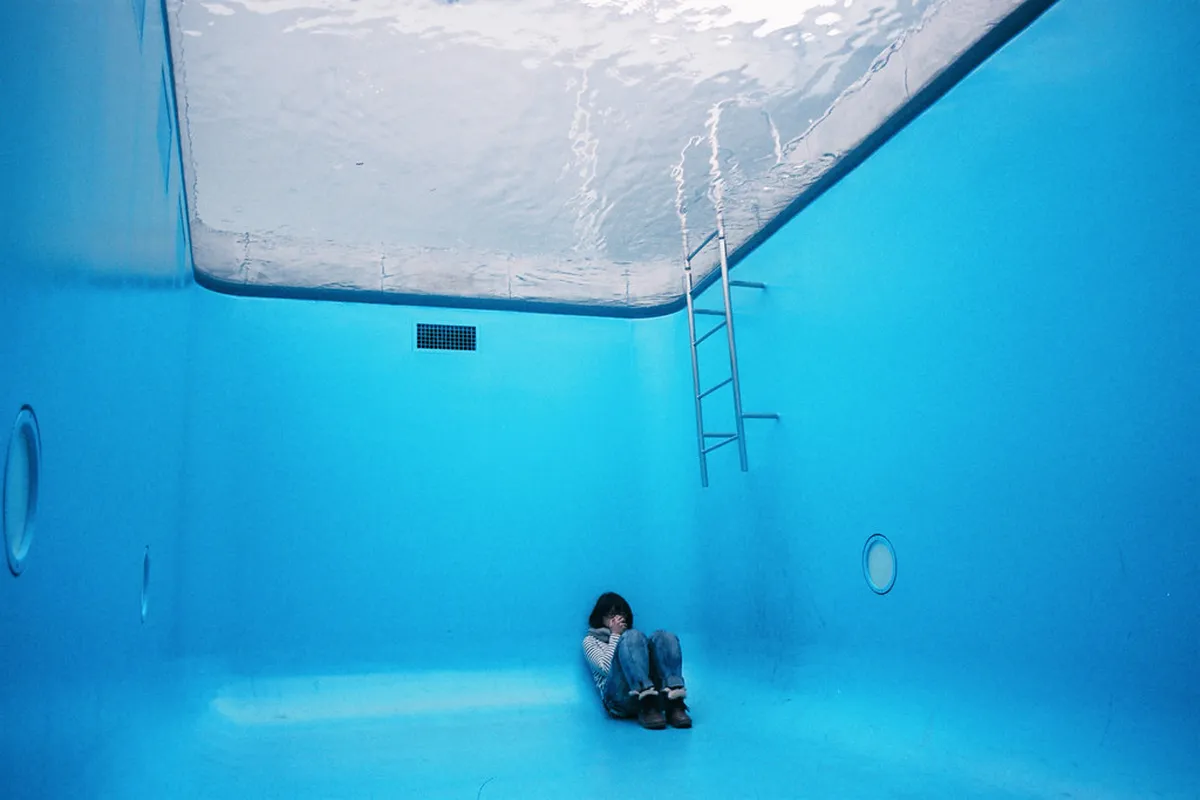 Leandro Erlich's Swimming Pool installation at Kanazawa's 21st Century Museum of Contemporary Art, where visitors appear to stand underwater