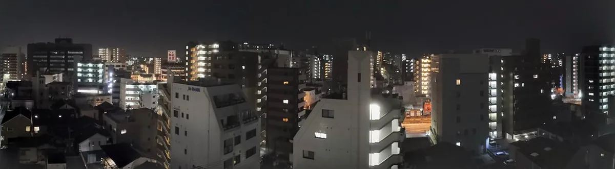 Panoramic view of Fukuoka city skyline and Hakata Bay seen from the rooftop of ACROS building in Japan