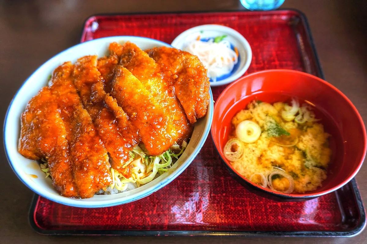 Sauce katsudon, kozuyu and local sake representing Aizuwakamatsu food, Japan — 1