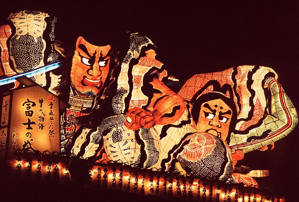 Illuminated lantern floats parading through a festival crowd in Aomori Prefecture, Japan — 1