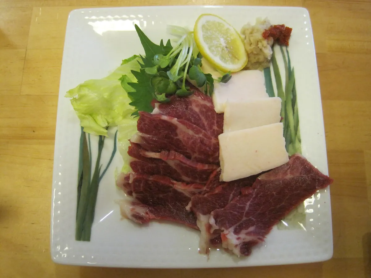 Traditional Japanese izakaya in Kumamoto serving local specialties including basashi horse meat sashimi