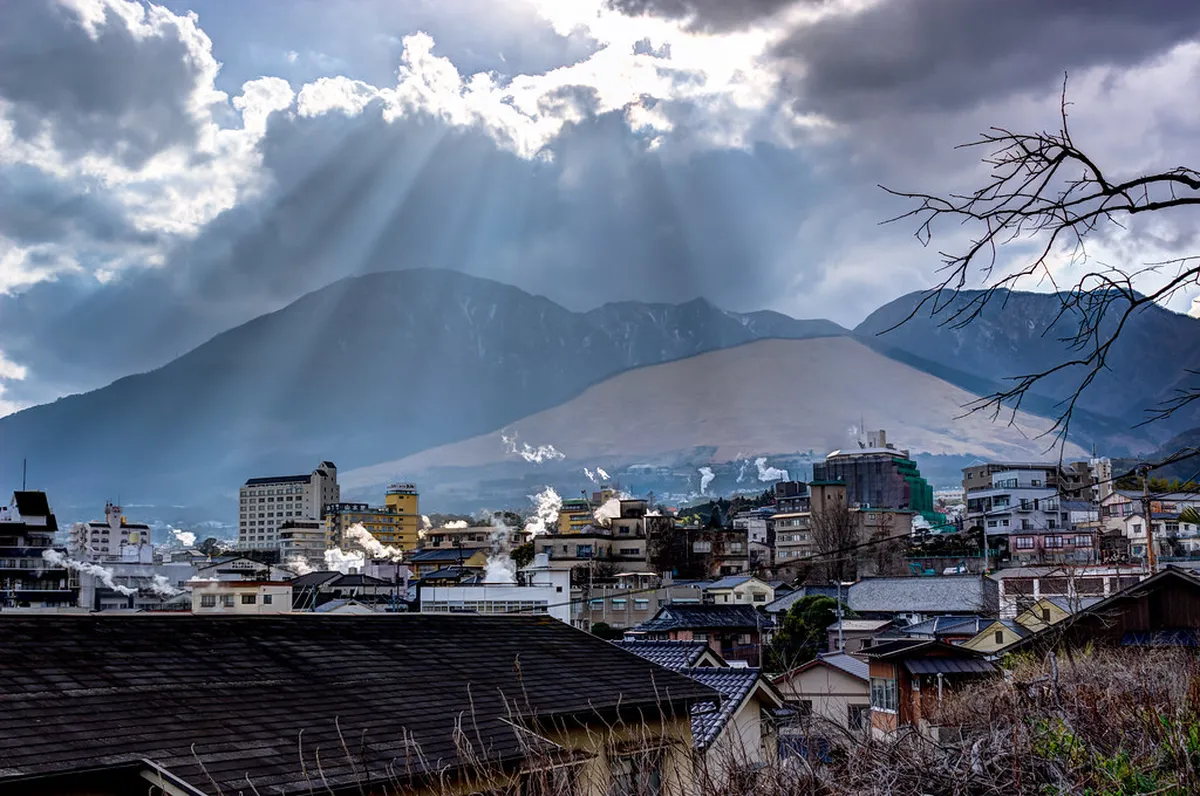 Mountain fire festival at night in Beppu Japan — flames illuminating the hillside during the annual Hatto Onsen Festival celebrations in April