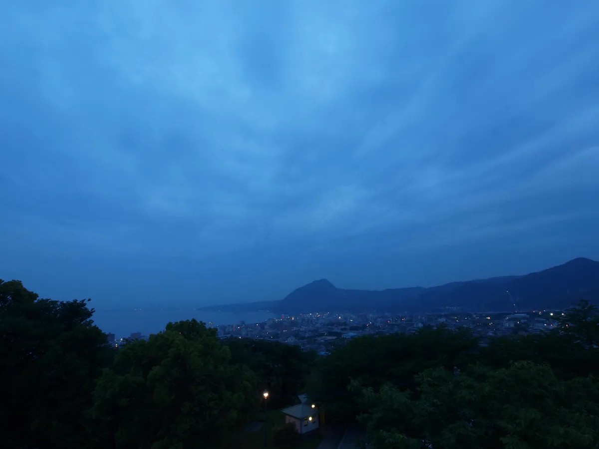 Beppu city and bay in Japan viewed from the hills — a winter visit reveals steam columns rising across the entire urban landscape below