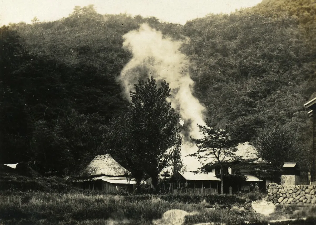 Steam rising over the historic hot spring streets of Beppu Japan during a morning walking tour