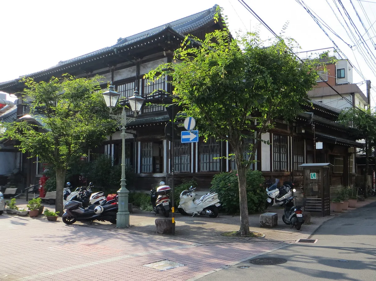 Peaceful private outdoor hot spring bath at a Beppu Japan ryokan surrounded by lush greenery
