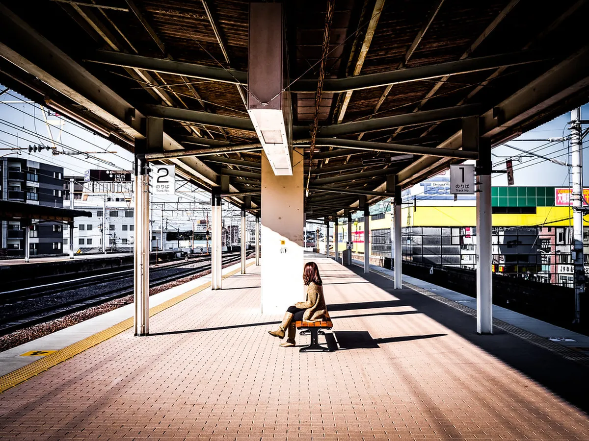 Beppu train station with families arriving to explore the volcanic city of Beppu, Japan