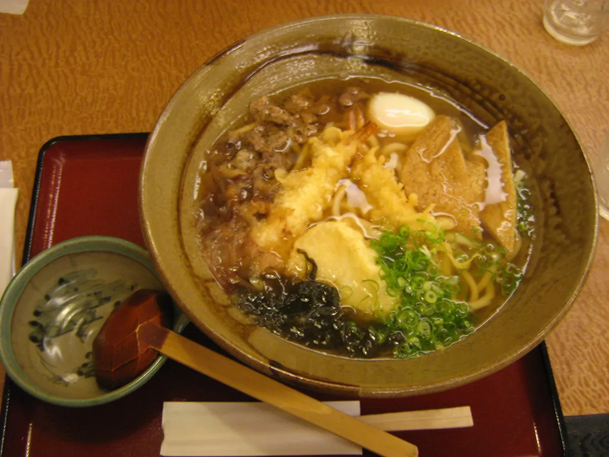 A bowl of Hiroshima ramen with clear tonkotsu-shoyu broth, thin noodles, chashu pork, and bean sprouts, Japan