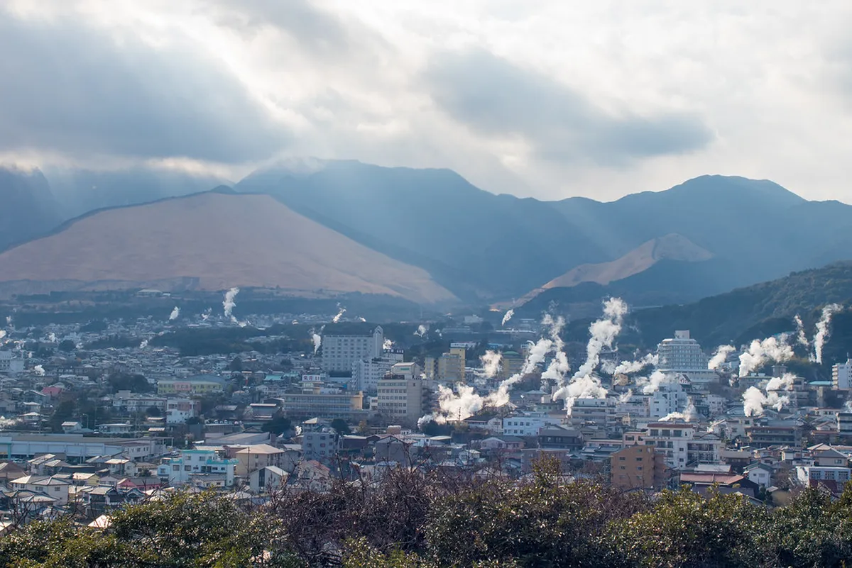 Geothermal steam vents in Beppu used for jigoku mushi steam cooking, a unique volcanic culinary tradition in Japan