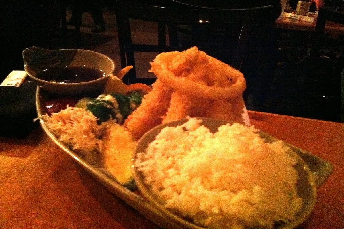 Golden-crisp chicken tempura with crispy batter and tender meat, served with kabosu citrus dipping sauce