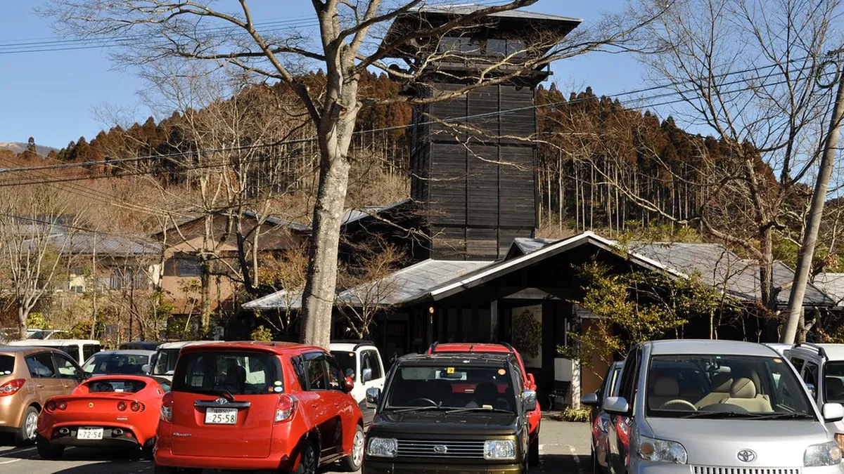 Rotenburo outdoor hot spring bath surrounded by rocks and steam at a Japanese ryokan