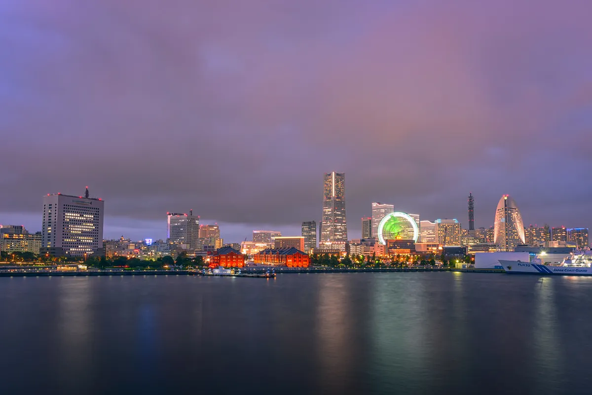Yokohama Minato Mirai waterfront skyline at dusk with the Landmark Tower and harbor reflections