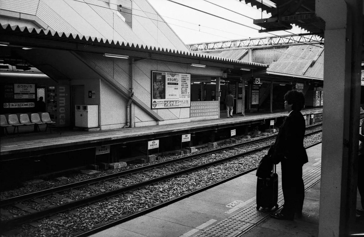 Nishitetsu Futsukaichi station platform where passengers transfer to the Dazaifu branch line Japan
