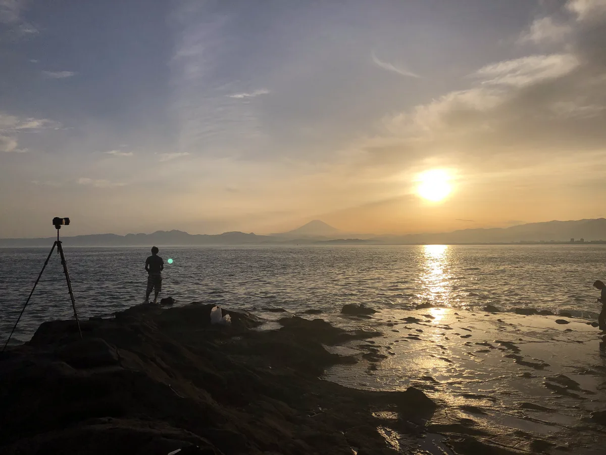 Ocean-view cafe seating at Chigogafuchi on Enoshima at sunset, Japan — 2