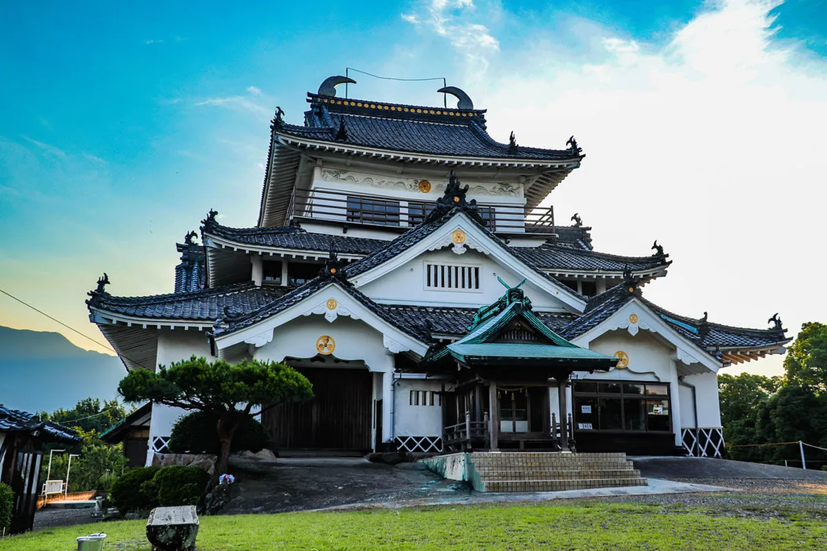 Traditional Meiji-era wooden bathhouse architecture with ornate roofline in the historic onsen city of Beppu Japan