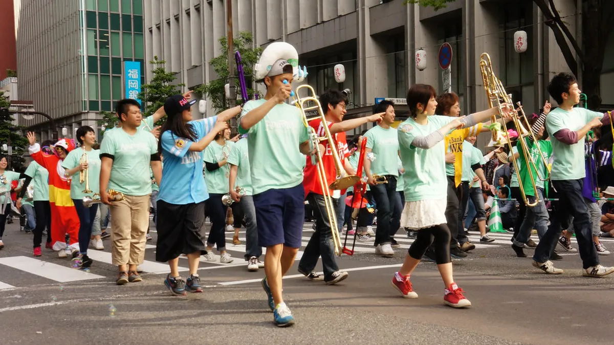 Hakata Dontaku festival parade with costumed performers marching through the streets of Fukuoka Japan