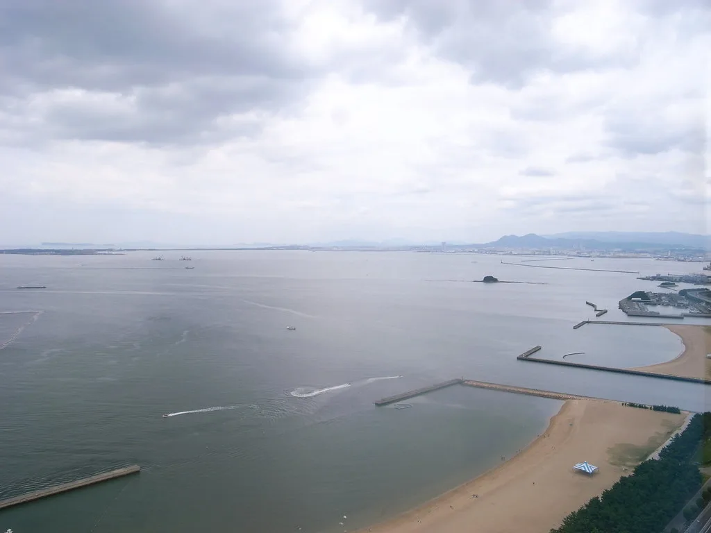 Fukuoka Tower standing on the Momochi seaside with Hakata Bay in the background