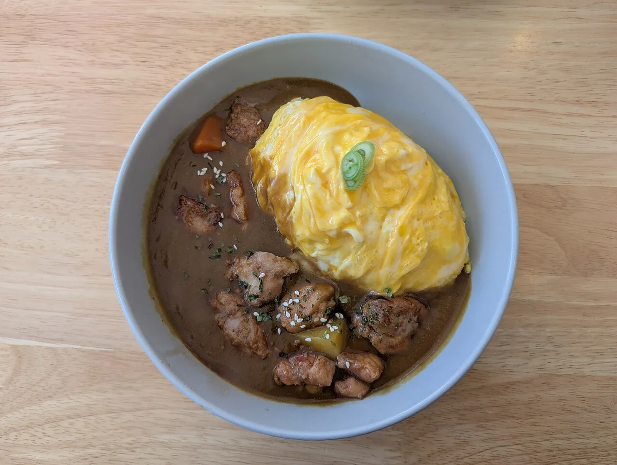 Furano omu-curry with a soft omelet over local vegetable curry, Japan — 1