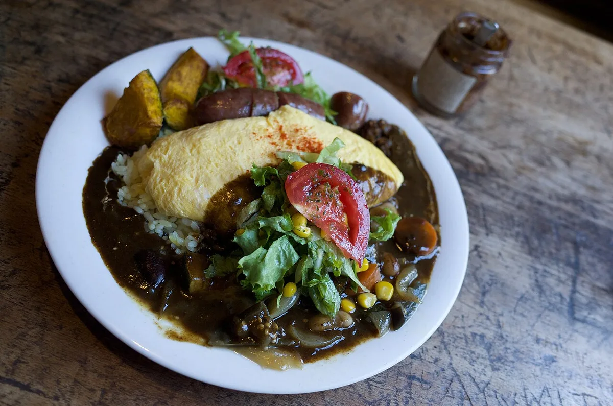 Furano omu-curry with a soft omelet over local vegetable curry, Japan — 2