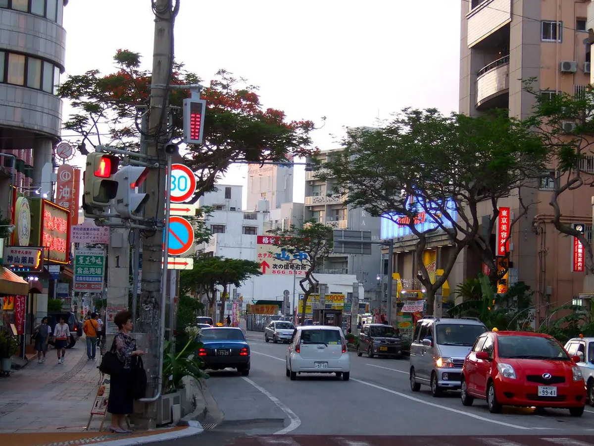 Kokusai Dori shopping street in Naha Okinawa lined with colorful shops restaurants and souvenir stalls