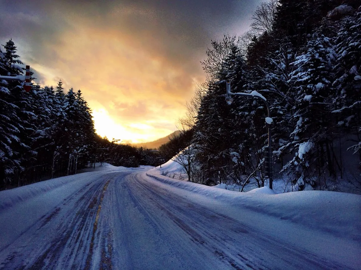 Snowy mountain road in Hokkaido during winter conditions for vehicle driving