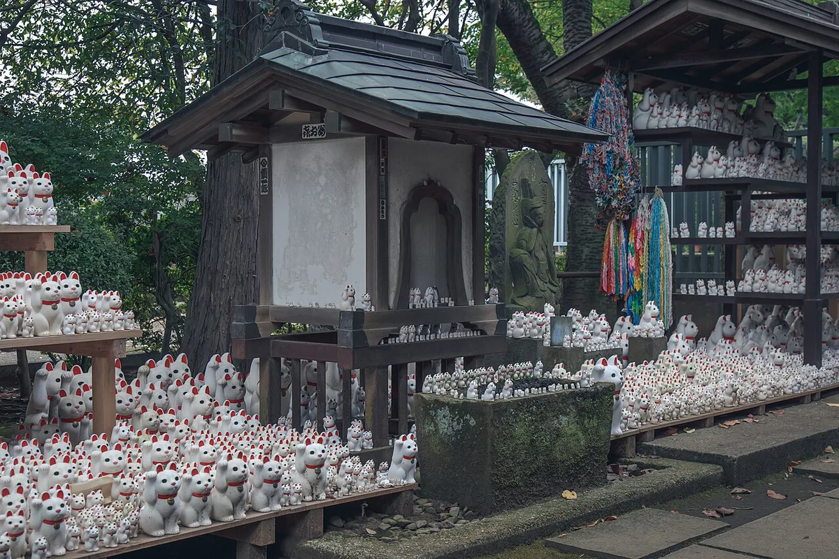 Rows of maneki-neko lucky cat figurines at Gotokuji Temple, Tokyo, Japan — 1