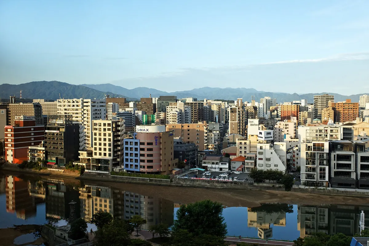 The colorful multi-level Canal City Hakata shopping complex with its winding indoor canal and outdoor plaza in Fukuoka, Japan