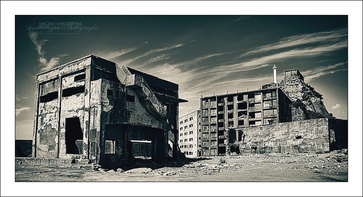 Crumbling walls and deteriorating concrete structures of the abandoned Hashima Island industrial settlement in Nagasaki