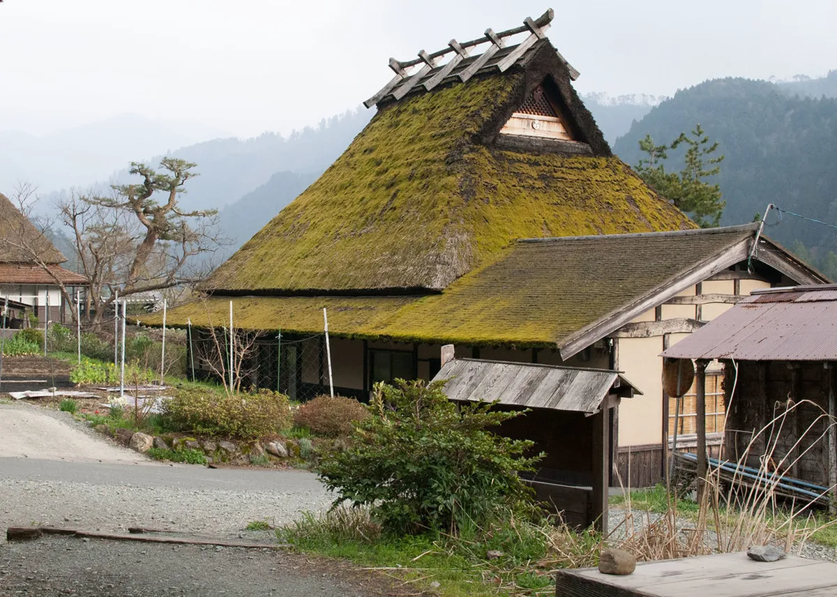 Steep gassho-zukuri thatched roof farmhouse in Takayama showing the 60-degree pitch designed to shed heavy mountain snow