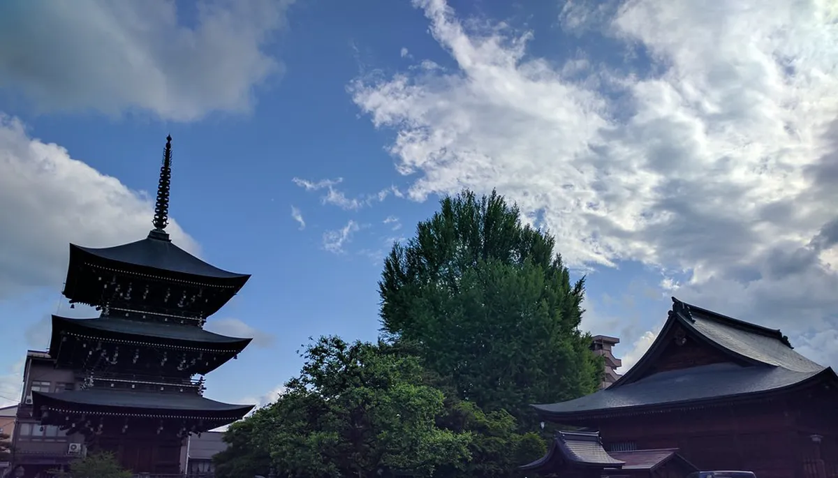 Hida Kokubunji temple three-story pagoda and main hall in Takayama surrounded by ancient cedar trees
