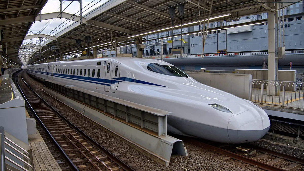 A shinkansen bullet train at the platform bound for Himeji