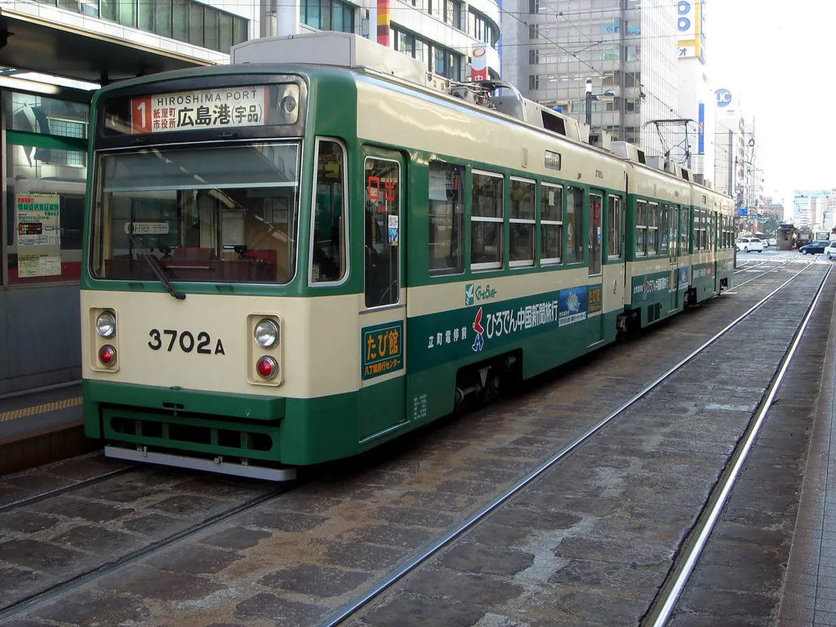 Hiroshima Hiroden streetcar tram running through the city center as an affordable way to get around in Japan