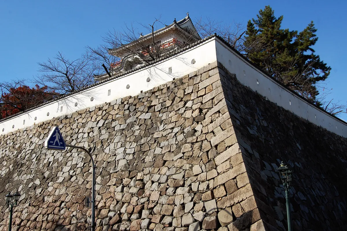 Original Edo-period stone walls and moat surrounding Hiroshima Castle keep, Hiroshima, Japan
