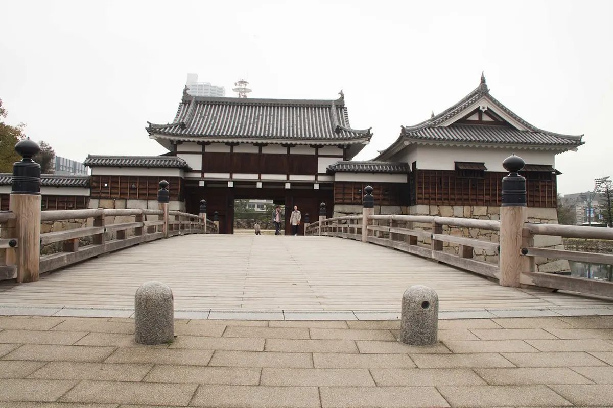 Hiroshima Castle grounds and Ninomaru second bailey with traditional wooden structures surrounding the moat in Japan