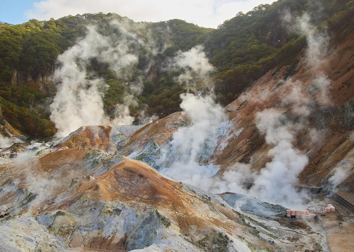 Autumn foliage reflected at Jigokudani hot spring valley in Noboribetsu, Hokkaido, Japan — 2