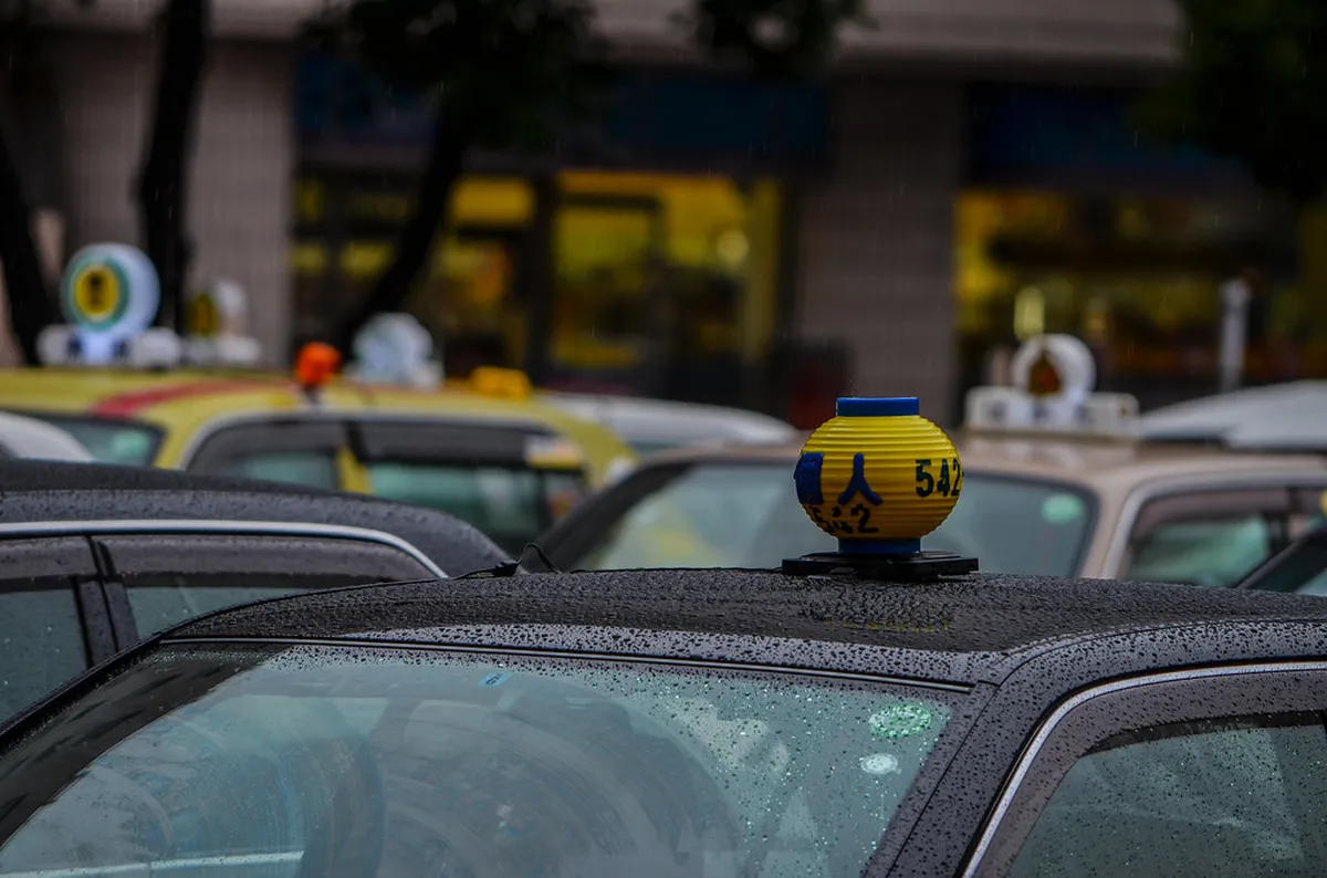 Taxi stand outside a major Fukuoka transportation hub offering door-to-door transfers to the city center in Japan