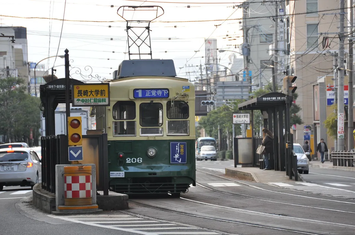 Nagasaki city tram traveling through downtown Nagasaki streets