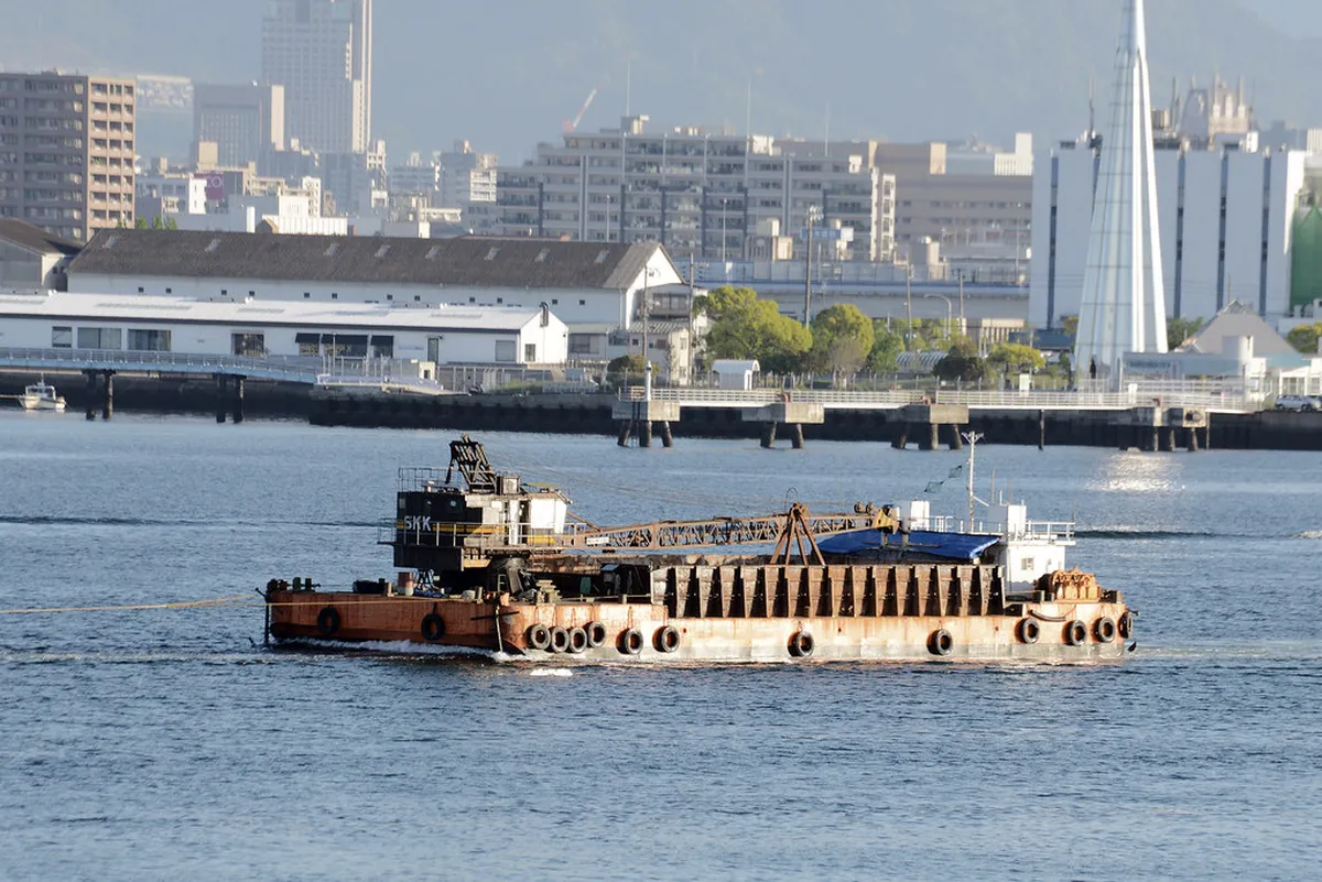 Oyster farming rafts floating in the calm waters of Hiroshima Bay near Miyajima Island, Japan