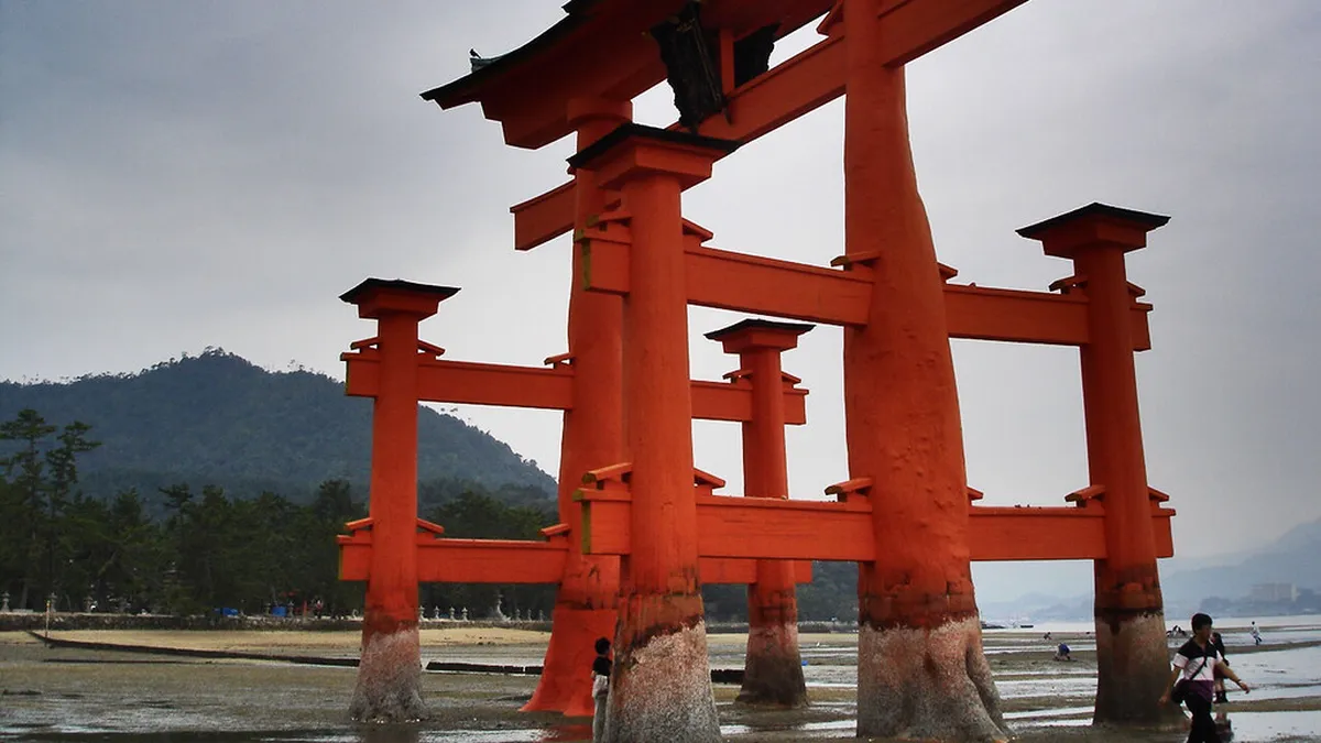 Itsukushima Shrine Great Torii gate rising from the sea at Miyajima island Hiroshima Japan
