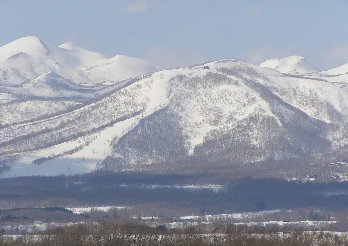 Snow-covered ski slopes at Niseko during peak powder season in January, Japan — 2
