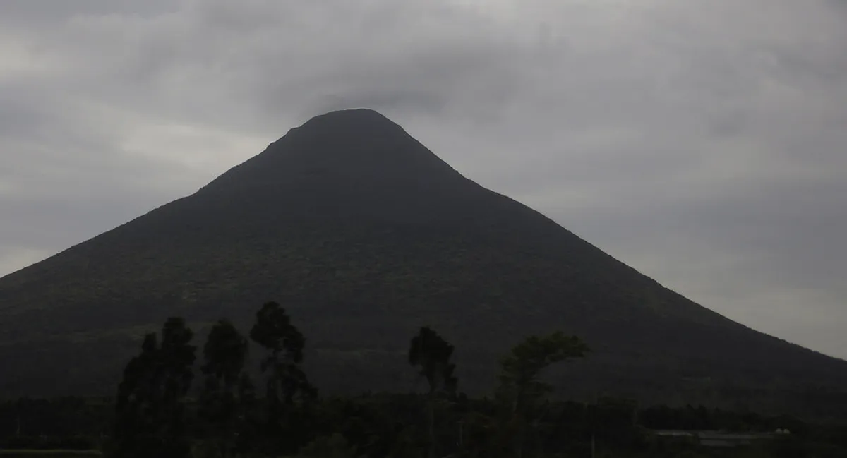 Mount Kaimon perfectly conical volcano rising above the coastline near Ibusuki in Kagoshima, Japan