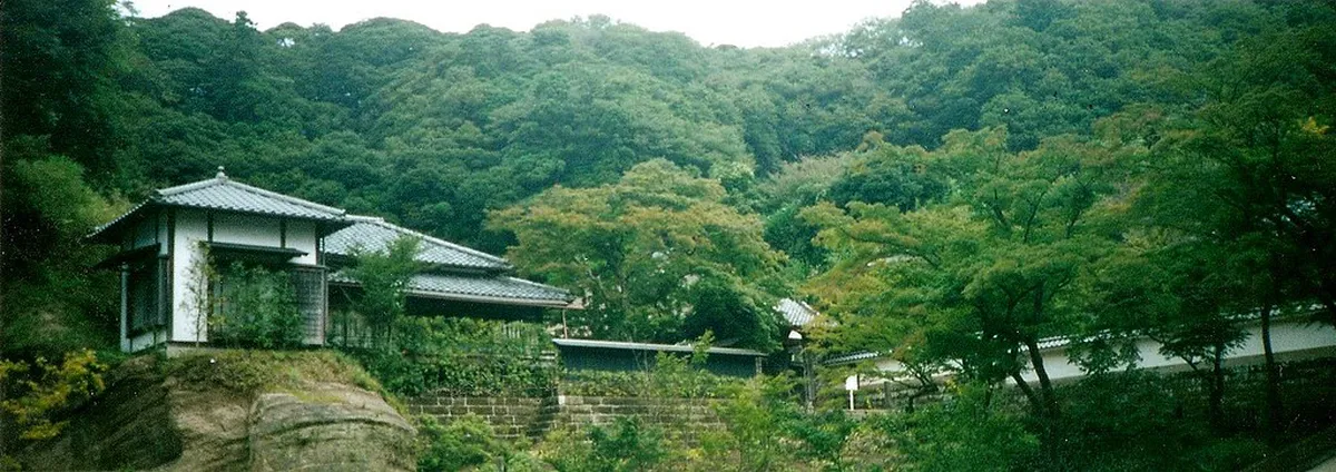 Engaku-ji Zen temple in Kamakura with autumn maple foliage framing ancient stone paths and wooden halls