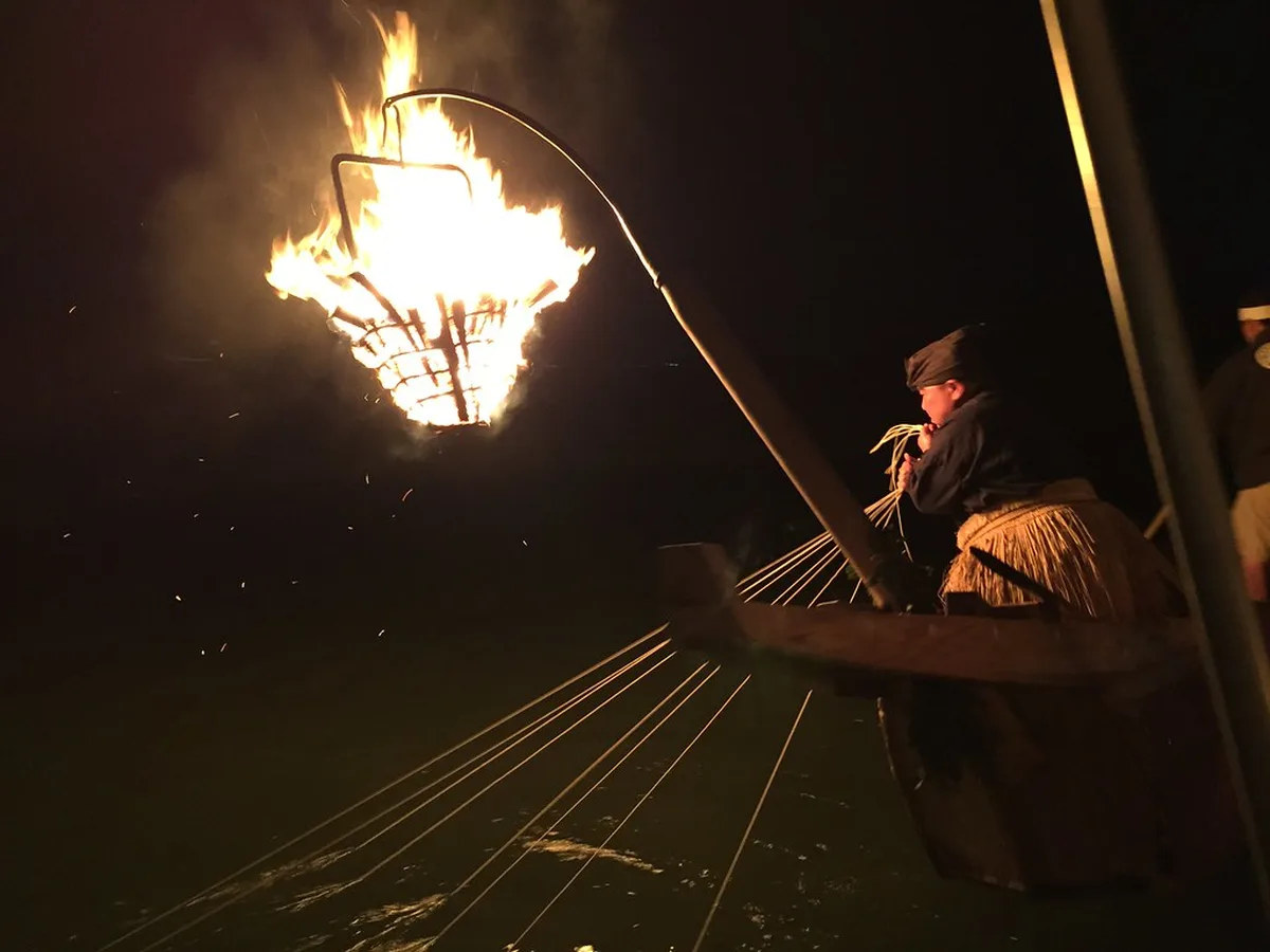 Cormorant fisherman working by torchlight on the Nagara River in Gifu