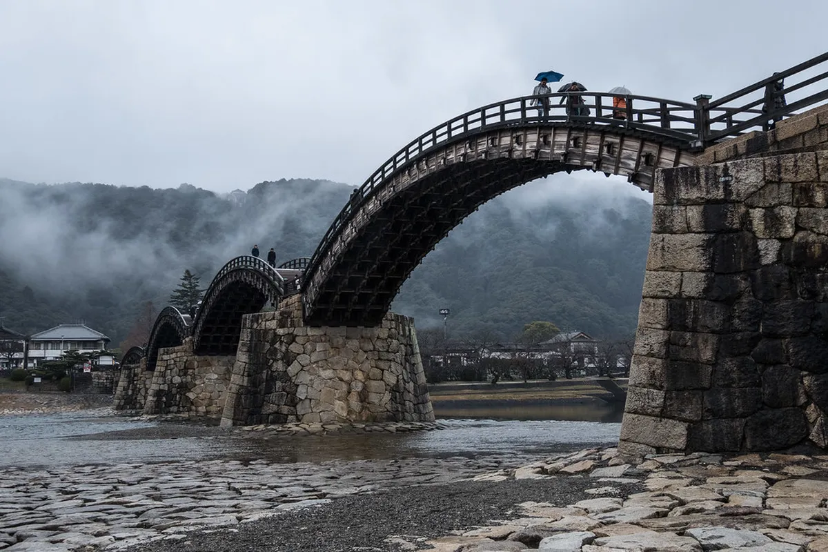 Five elegant wooden arches of Kintaikyo Bridge spanning the Nishiki River in Iwakuni, Japan