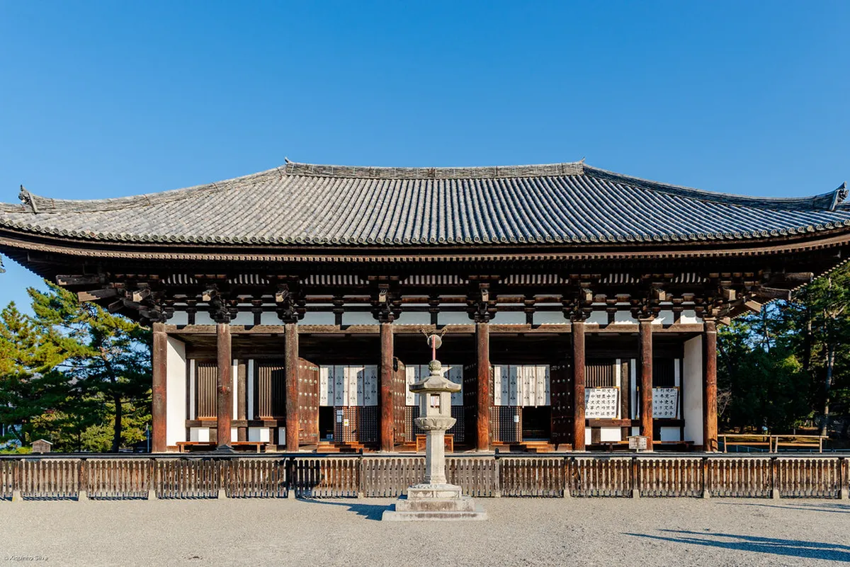Kofuku-ji five-story wooden pagoda and temple buildings reflected in Sarusawa Pond in Nara, Japan