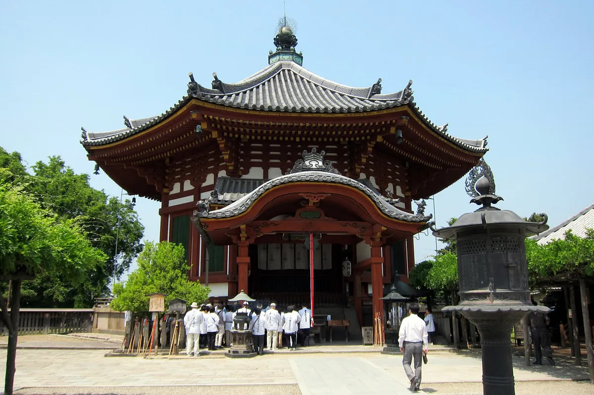Kofuku-ji Temple five-story pagoda rising above Nara's rooftops against a blue sky in Japan