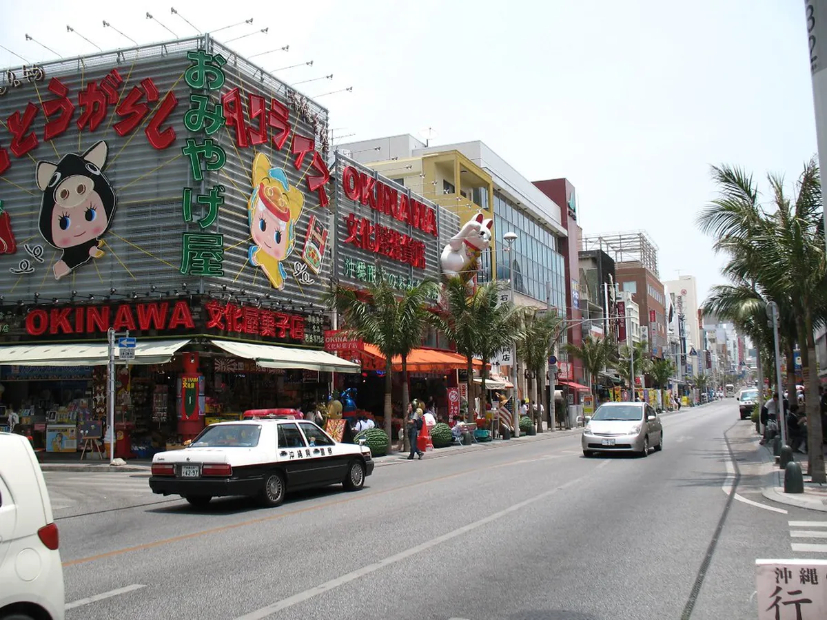 Kokusai Street stretching through central Naha, lined with colorful shops and signs along the Miracle Mile in Okinawa