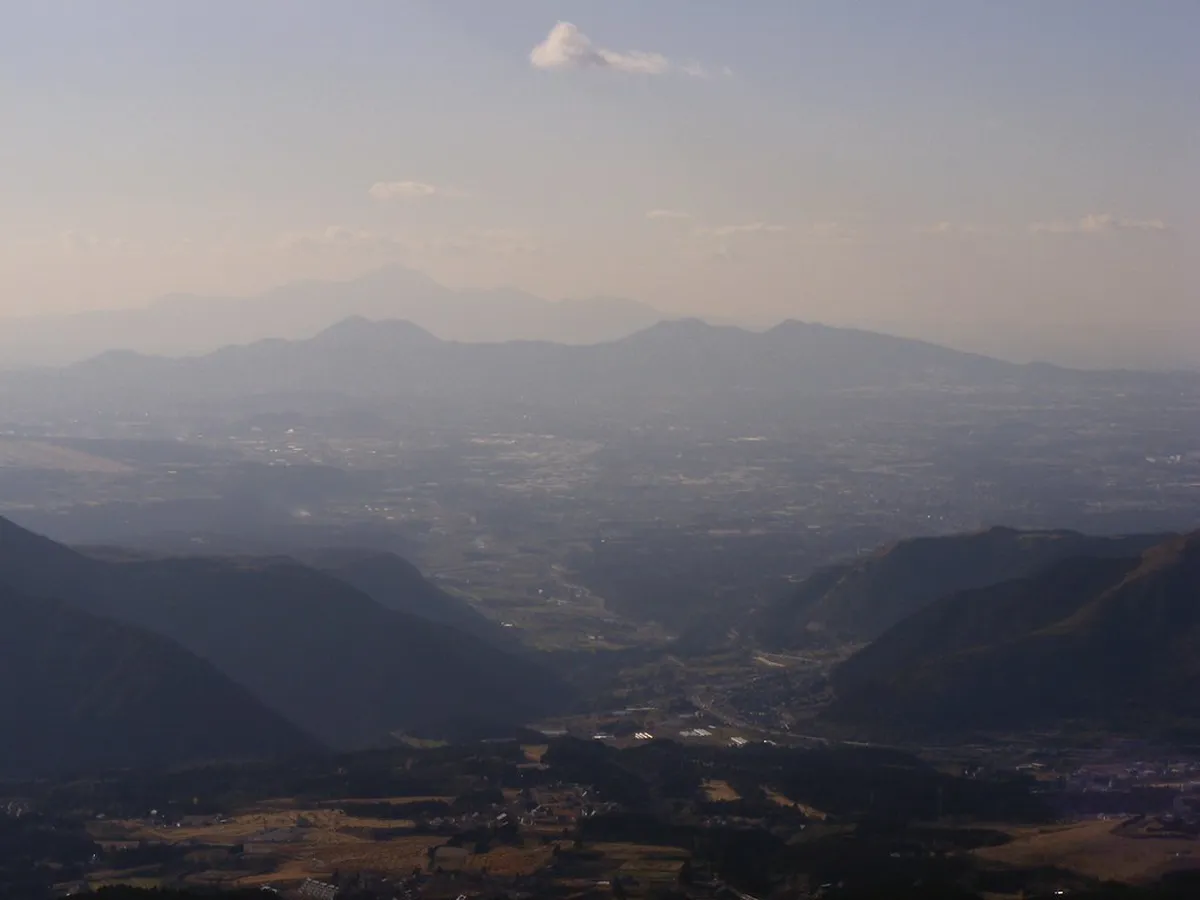 Mount Aso caldera plateau in winter with brown grasslands and volcanic peaks in Kumamoto, Japan