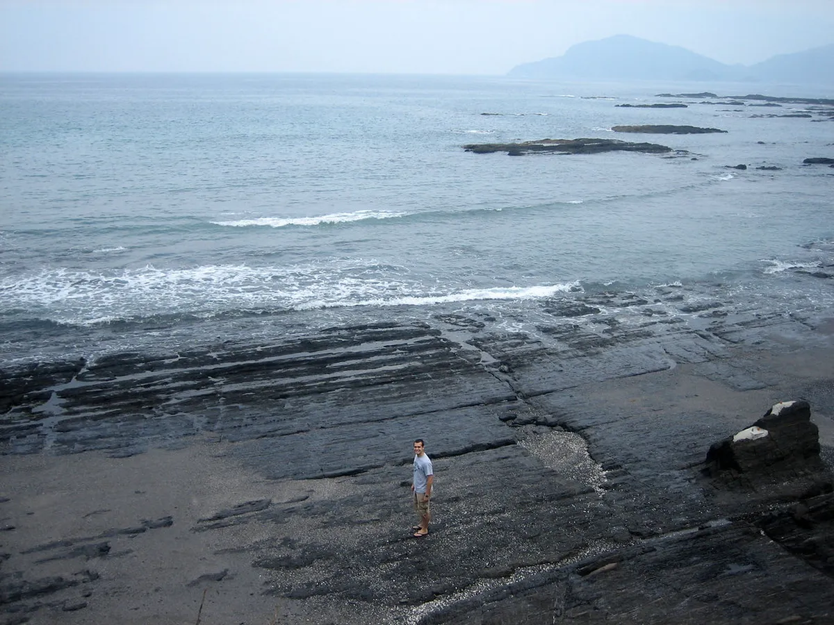 Calm ocean view from the Amakusa Islands coastline in Kumamoto Prefecture, Japan with small fishing boats on the water