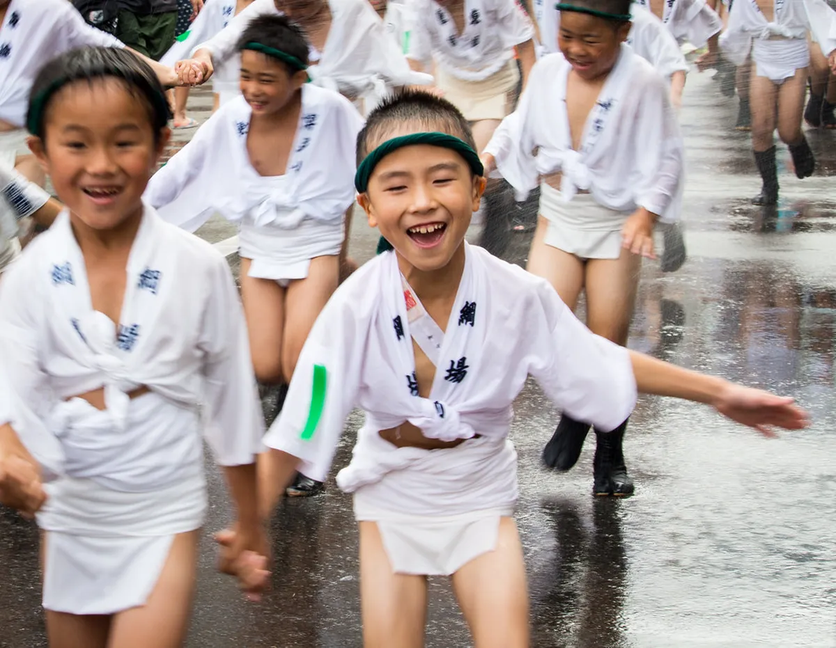 Hakata Gion Yamakasa festival procession near Kushida Shrine in Fukuoka, Japan