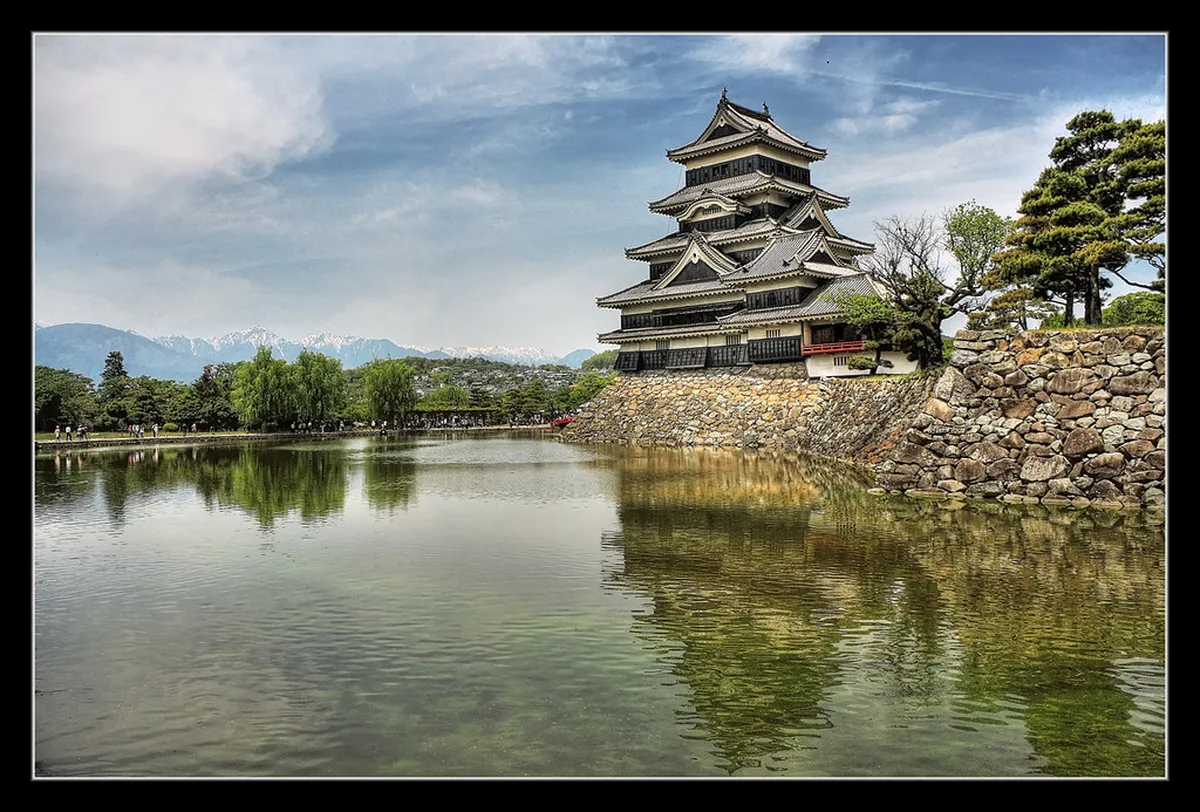 Close-up view of Matsumoto Castle’s original wooden interior floors and narrow defensive windows in Nagano, Japan